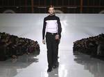 Dior Homme will hold its first menswear fashion show in the Chinese capital of Beijing , in conjunction with the re-opening of its renovated Seasons Place boutique