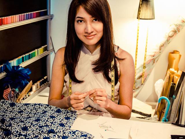 Designer Priscilla Shunmugam puts a contemporary spin on traditional clothing, placing great importance on the cut and the fit of the clothing, striving for longevity through its classic-inspired designs | Seen here with the <a href="http://h20386.www2.hp.com/SingaporeStore/html/hadid-promo-ols.html">HP Spectre XT</a> in her atelier