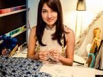 Designer Priscilla Shunmugam puts a contemporary spin on traditional clothing, placing great importance on the cut and the fit of the clothing, striving for longevity through its classic-inspired designs | Seen here with the <a href="http://h20386.www2.hp.com/SingaporeStore/html/hadid-promo-ols.html">HP Spectre XT</a> in her atelier