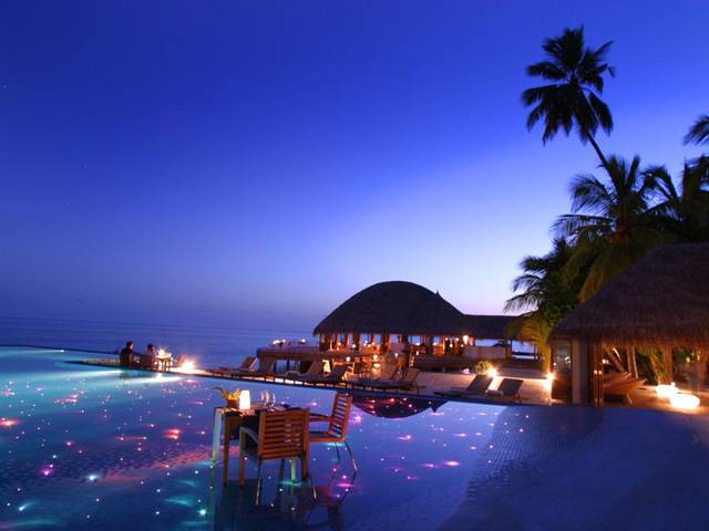 Huvafen Fushi ideally mixes Maldives style with hip and chic features with thatched rooms villas on the outside and on the inside, unique amenities, sophisticated design, contemporary furniture, high-tech equipment