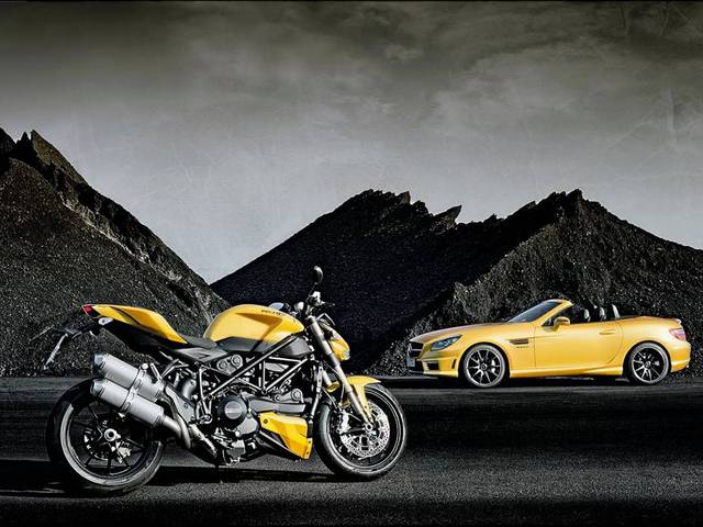 The SLK 55 AMG and Ducati 848 in "Streetfighter Yellow" on display at the Bologna Car Show