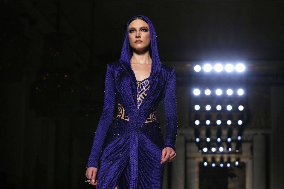 Reviving the look iconicized by Grace Jones in the 1980s, Donatella Versace channels the "contemporary goddess" in her showcase at Haute Couture Week in Paris
