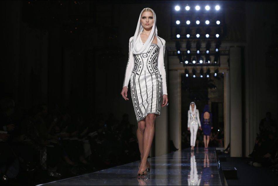 Reviving the look iconicized by Grace Jones in the 1980s, Donatella Versace channels the "contemporary goddess" in her showcase at Haute Couture Week in Paris