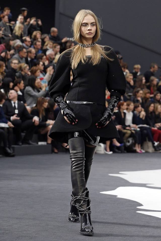 Karl Lagerfeld led the celebrations of the 100th anniversary of the French fashion house, in a show set around a huge globe dotted with 300 Chanel flags representing its stores around the world