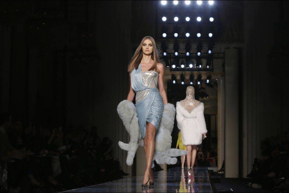 Reviving the look iconicized by Grace Jones in the 1980s, Donatella Versace channels the "contemporary goddess" in her showcase at Haute Couture Week in Paris