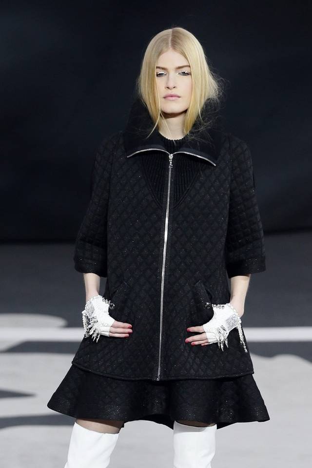 Karl Lagerfeld led the celebrations of the 100th anniversary of the French fashion house, in a show set around a huge globe dotted with 300 Chanel flags representing its stores around the world