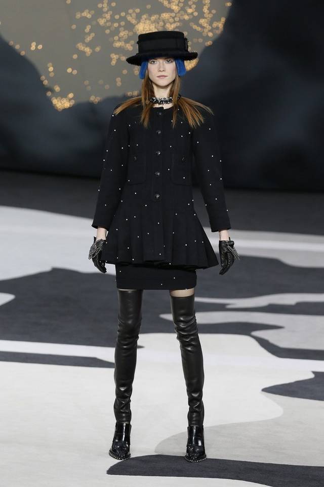 Karl Lagerfeld led the celebrations of the 100th anniversary of the French fashion house, in a show set around a huge globe dotted with 300 Chanel flags representing its stores around the world