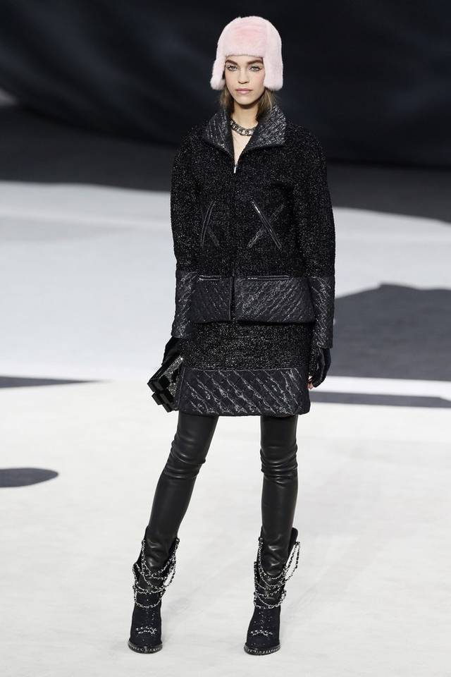 Karl Lagerfeld led the celebrations of the 100th anniversary of the French fashion house, in a show set around a huge globe dotted with 300 Chanel flags representing its stores around the world