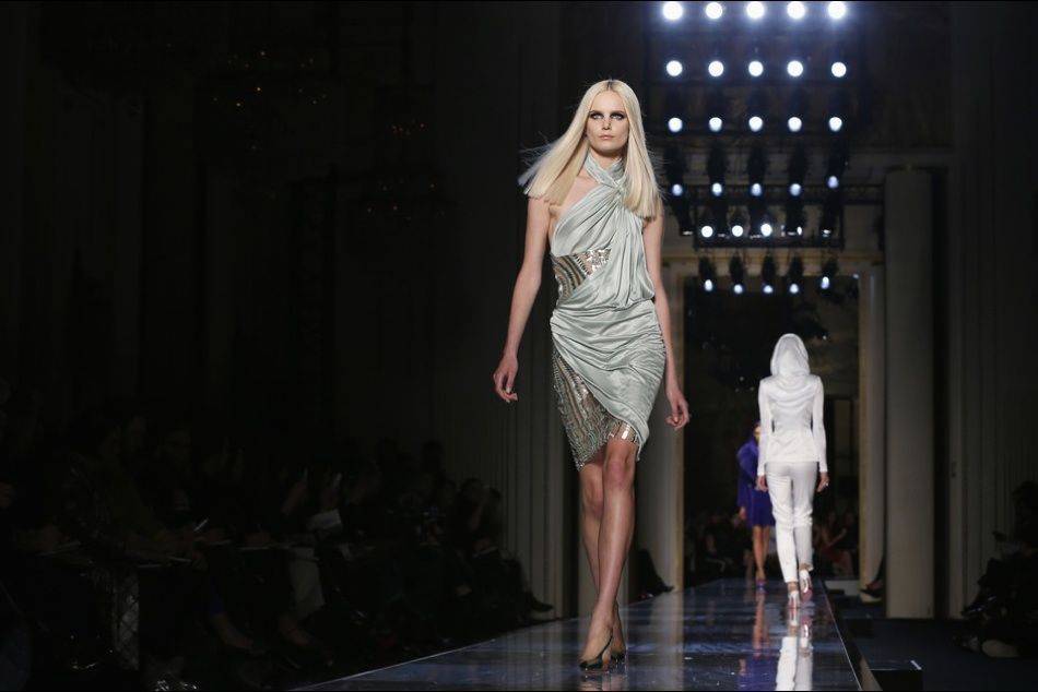 Reviving the look iconicized by Grace Jones in the 1980s, Donatella Versace channels the "contemporary goddess" in her showcase at Haute Couture Week in Paris