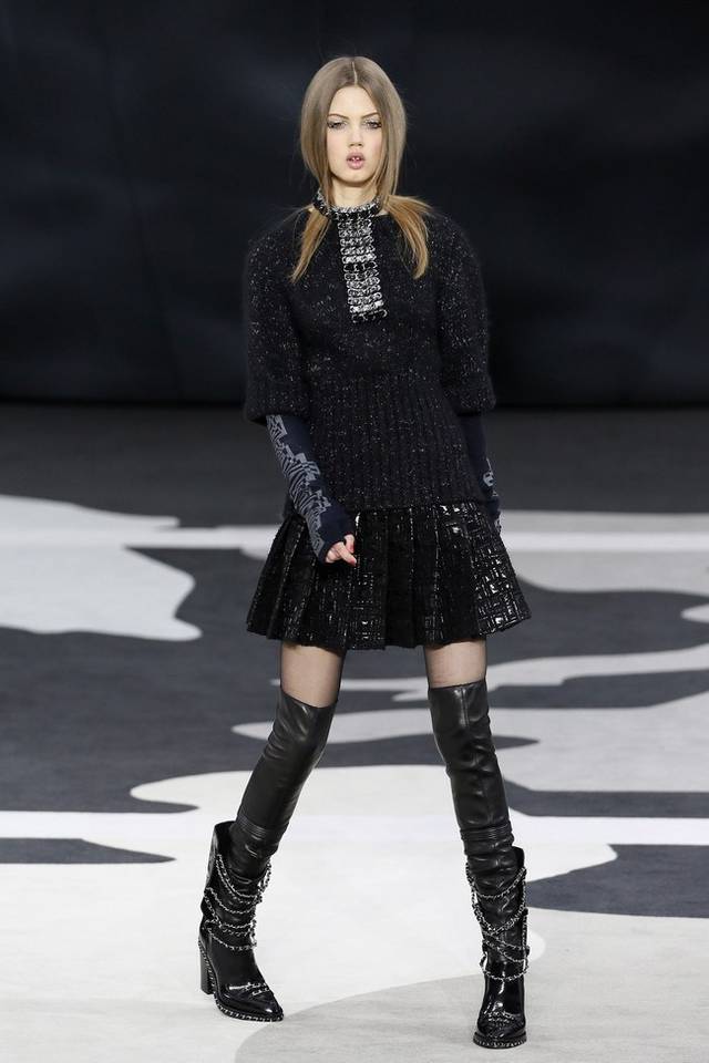 Karl Lagerfeld led the celebrations of the 100th anniversary of the French fashion house, in a show set around a huge globe dotted with 300 Chanel flags representing its stores around the world