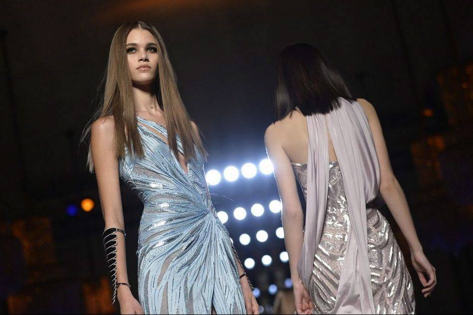 Reviving the look iconicized by Grace Jones in the 1980s, Donatella Versace channels the "contemporary goddess" in her showcase at Haute Couture Week in Paris