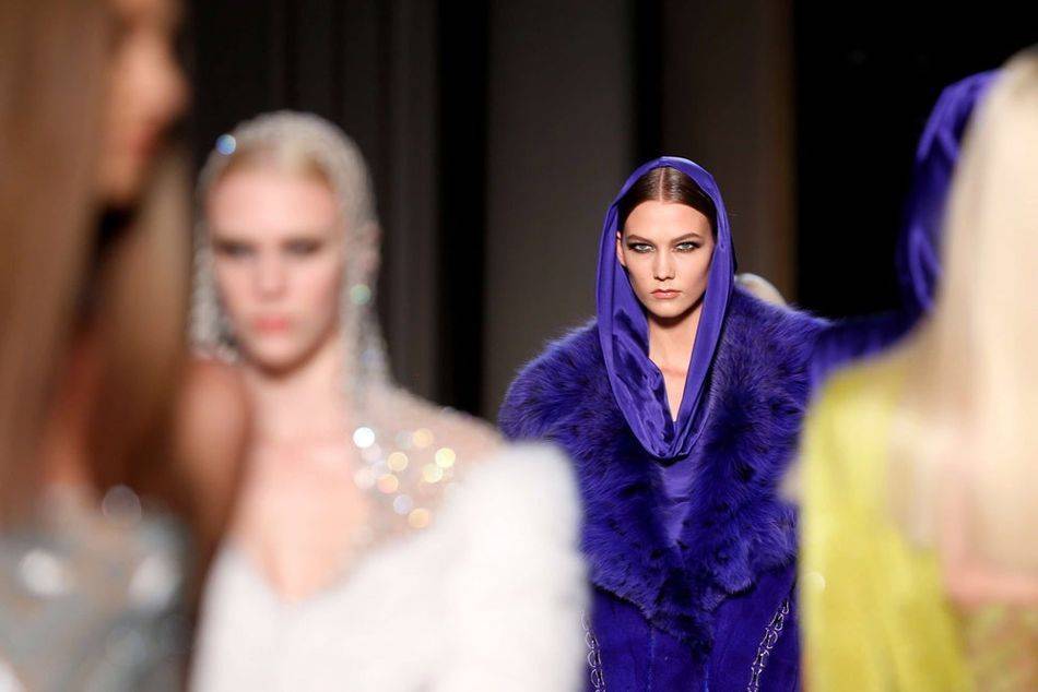 Reviving the look iconicized by Grace Jones in the 1980s, Donatella Versace channels the "contemporary goddess" in her showcase at Haute Couture Week in Paris